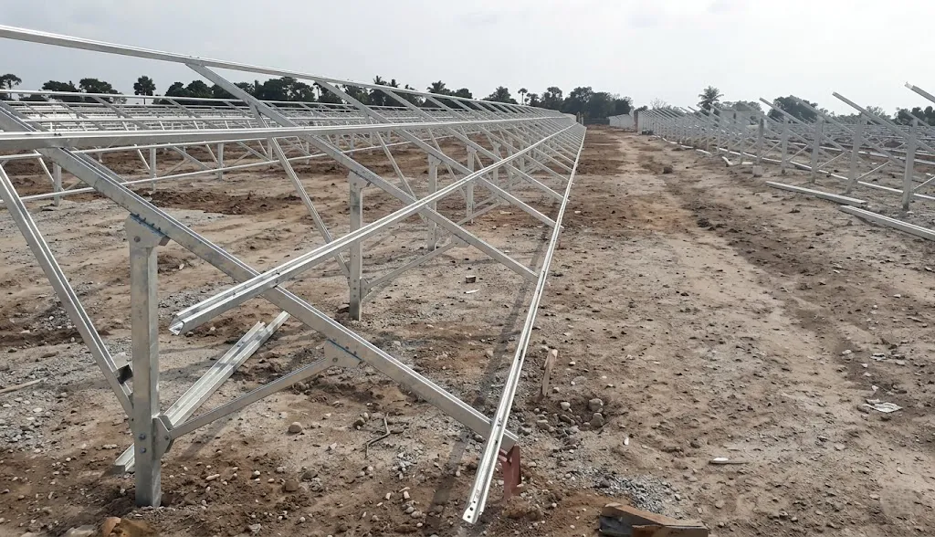 Ramming Pile Solar Mounting galvanized steel structure installed on an open ground construction site.
