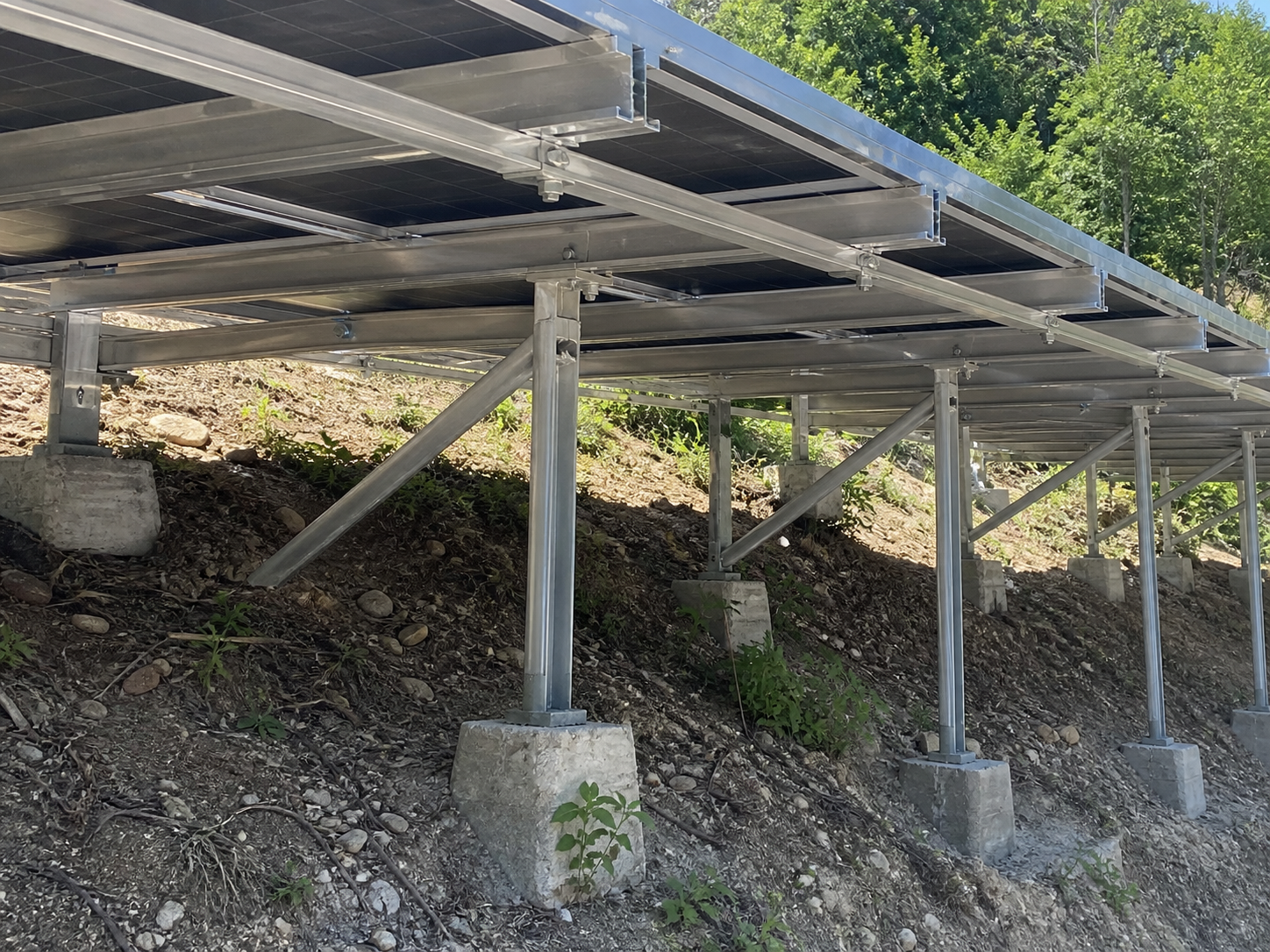 Custom ground mount installation detail on sloped terrain